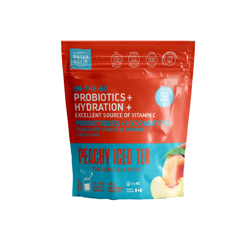 Red and blue package of peachy iced tea with probiotics and hydration on a white background