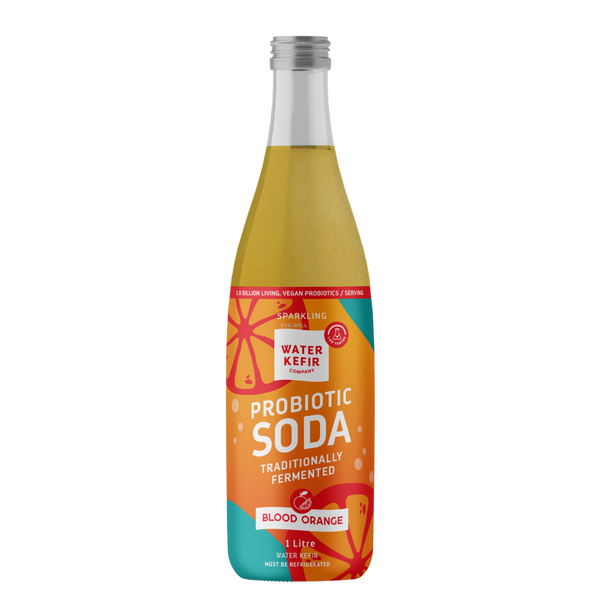 Bottle of probiotic soda with colorful label on a white background