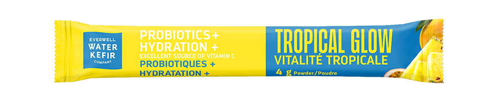 A single Overland Water Kefir Tropical Glow probiotic drink mix stick pack, featuring a bright yellow and blue design with white text, set against a plain white background.