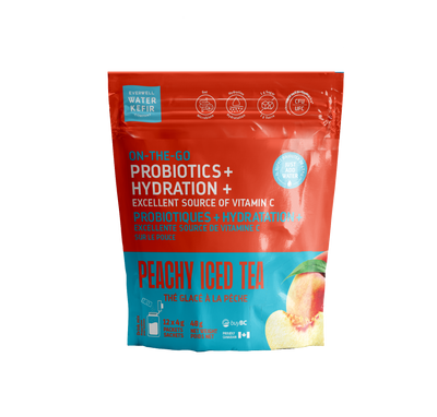 Red and blue package of peachy iced tea with probiotics and hydration on a white background