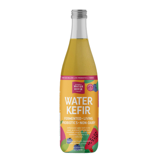 Bottle of Water Kefir with a colorful label on a white background