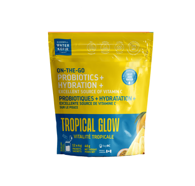 Yellow and blue package of 'Tropical Glow' probiotics on a white background
