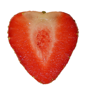Heart-shaped strawberry cut in half on a white background